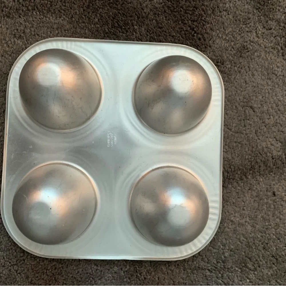 Wilton Vintage 4-cavity Mini Doll Dress cake pan.  Good used condition.